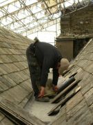 Jon Tonkin-Couch measuring slates for re-fixing